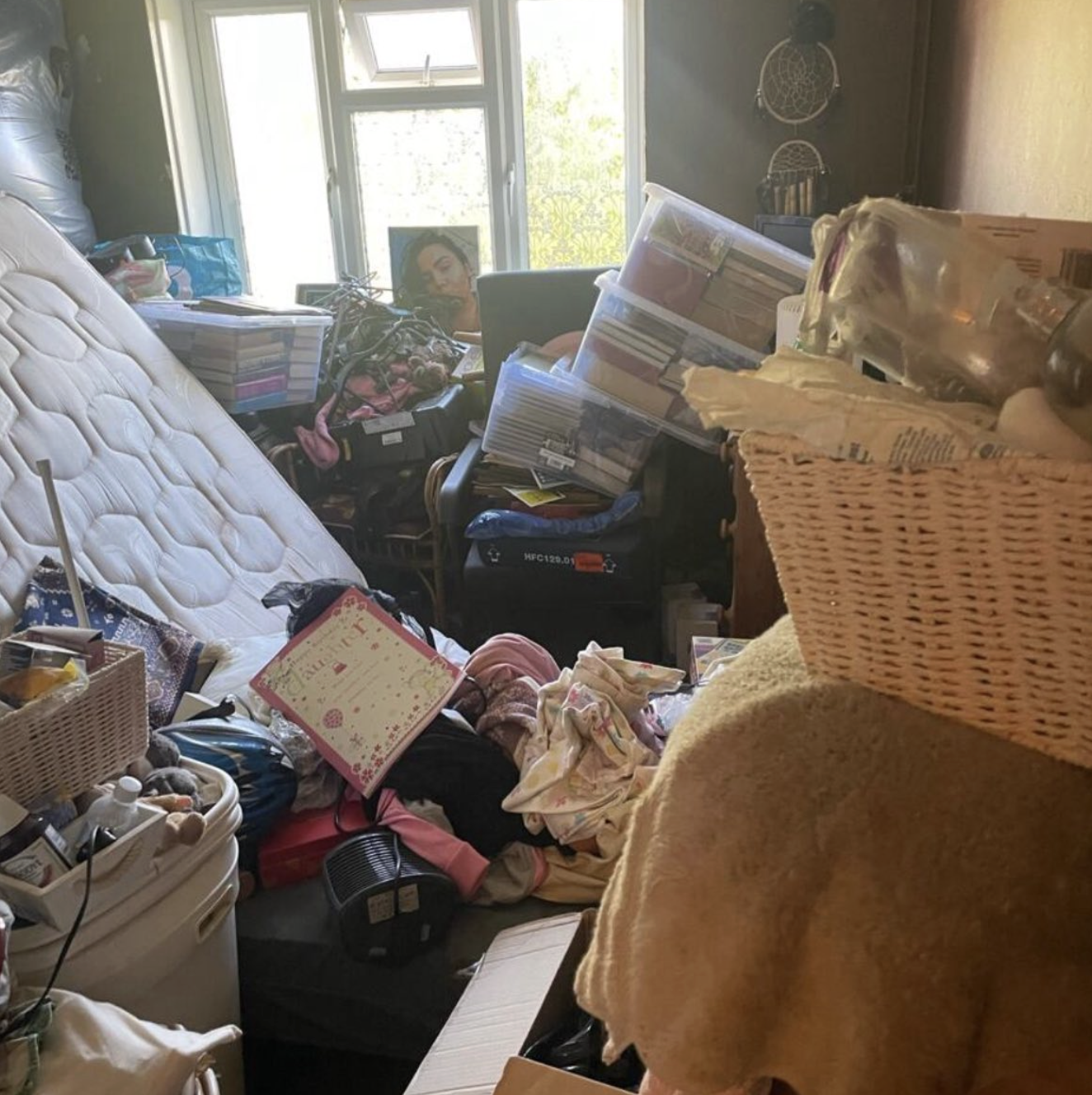 House clearance — hoarded bedroom before removal